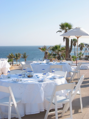 Summer wedding reception with beach and blue skies
