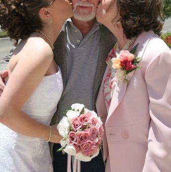 elegant mother of the bride in wedding photo with daughter